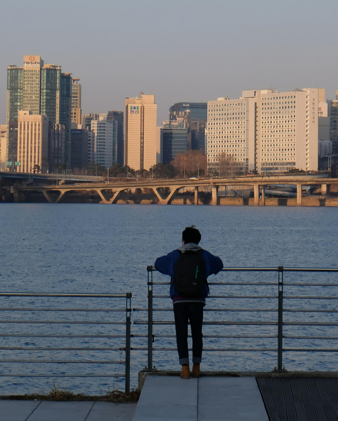Boy staring out to sea